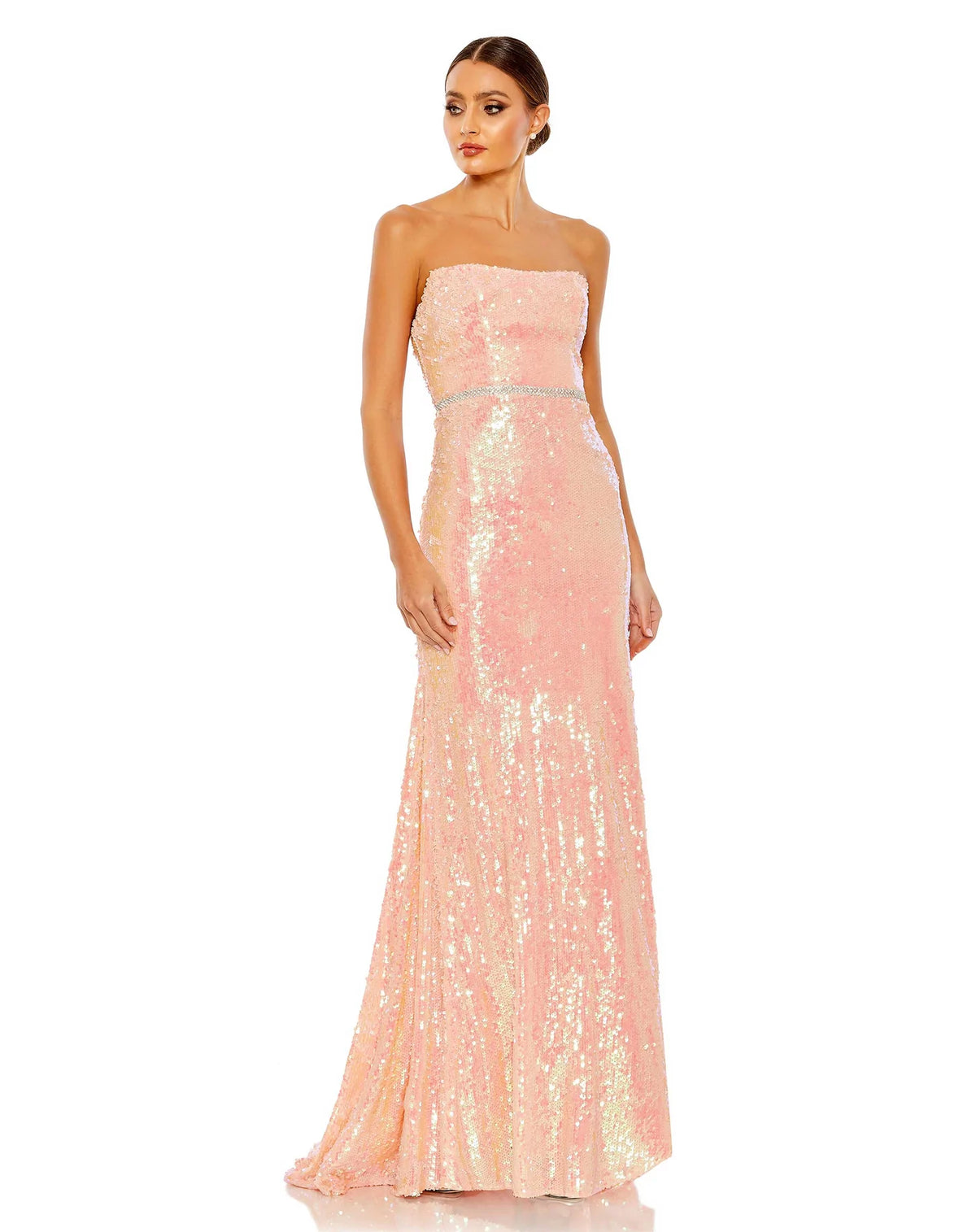 This elegant strapless, coral pink toned, floor length, fitted, formal dress is picture perfect. With an elongating column style and sequinned fabric with a gorgeous crystal belt to cinch in the waist, is finished with a glamorous sweeping train. This gown is perfect for wedding guests, special occasions and proms! 