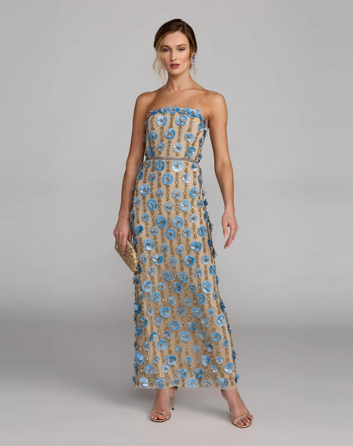 10128-NudeBlue-AB3 (1).jpg: High-resolution studio shot highlighting the texture of the 3D flowers and rhinestone waistband on the Nude Blue dress.
