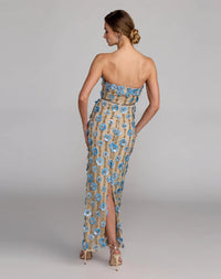 10128-NudeBlue-AB2 (1).jpg: Full-length back view of the strapless Nude Blue column gown featuring 3D floral paillettes and vertical gold beadwork.