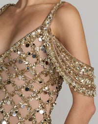 Close-up of a gold sequin dress with a gray background