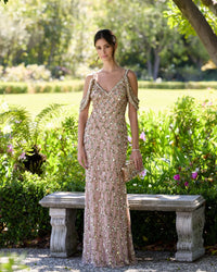 Woman in a sparkly dress standing in a garden