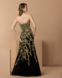 Mac Duggal #10274 black gold gown lifestyle back view