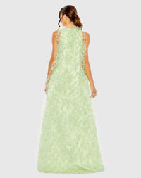 Back view of the Mint formal dress highlighting the continuous feather design, clean zip closure, and floor-sweeping back hem.