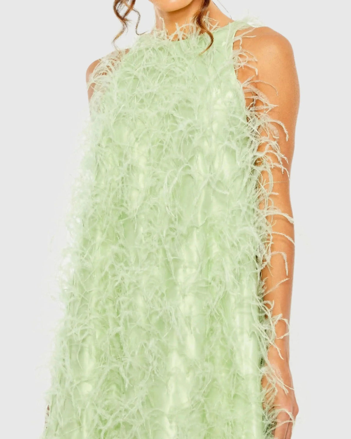 Close-up studio shot focusing on the smooth high neckline and the rich, plush texture of the mint green feathers.