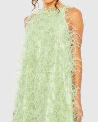 Close-up studio shot focusing on the smooth high neckline and the rich, plush texture of the mint green feathers.