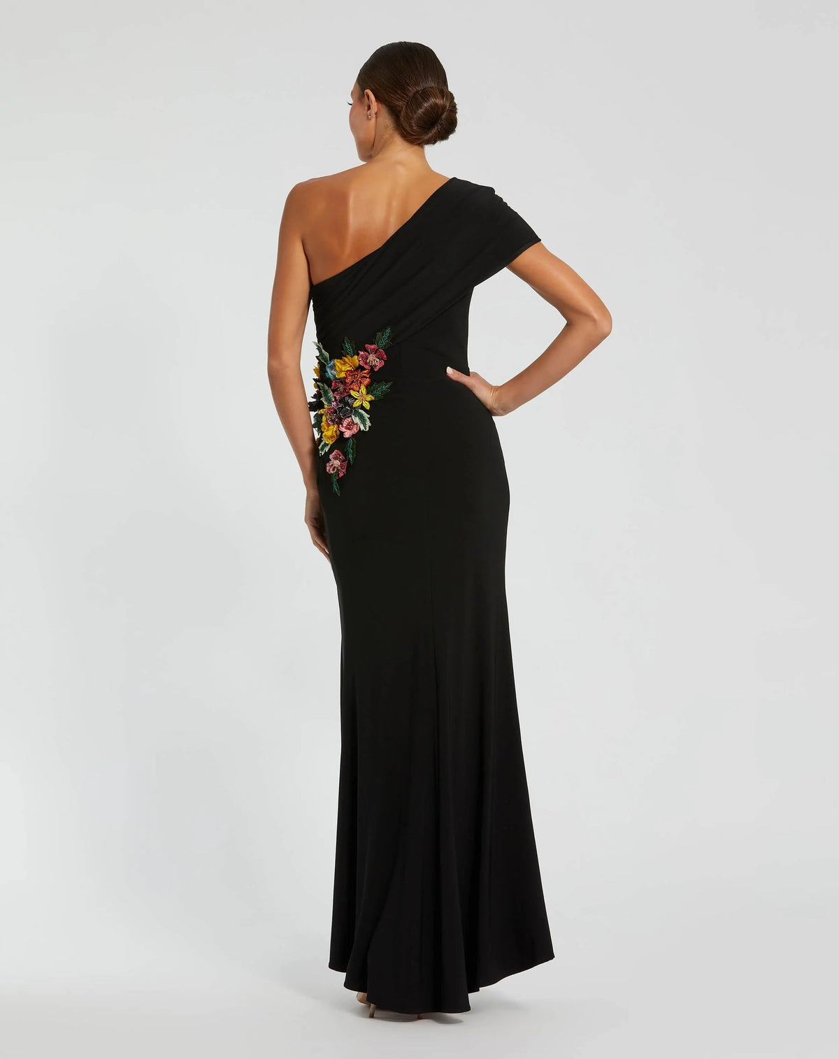back-view-of-fitted-black-jersey-formal-gown-with-front-slit