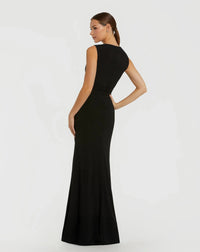 Woman wearing a black evening gown on a white background