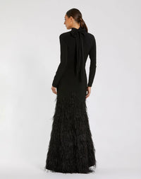 Black evening gown with feathered skirt on a white background