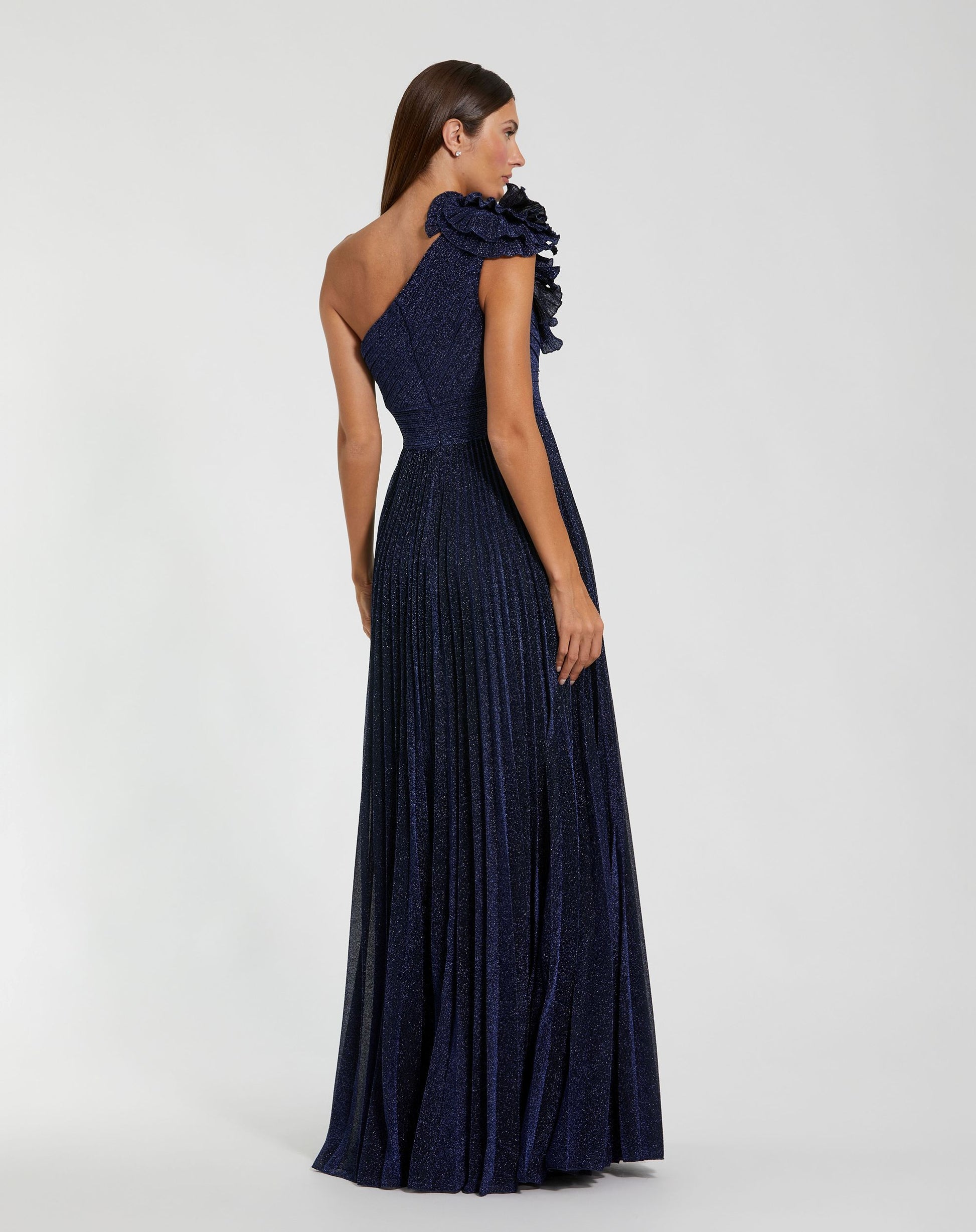 Navy blue evening gown with ruffled shoulder design on a white background