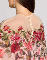 Detailed close-up of the back illusion neckline, button closure, and delicate floral beadwork.