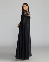 Side profile view of Mac Duggal 11954 black crepe gown featuring sheer chiffon cape sleeves and embroidered bodice details