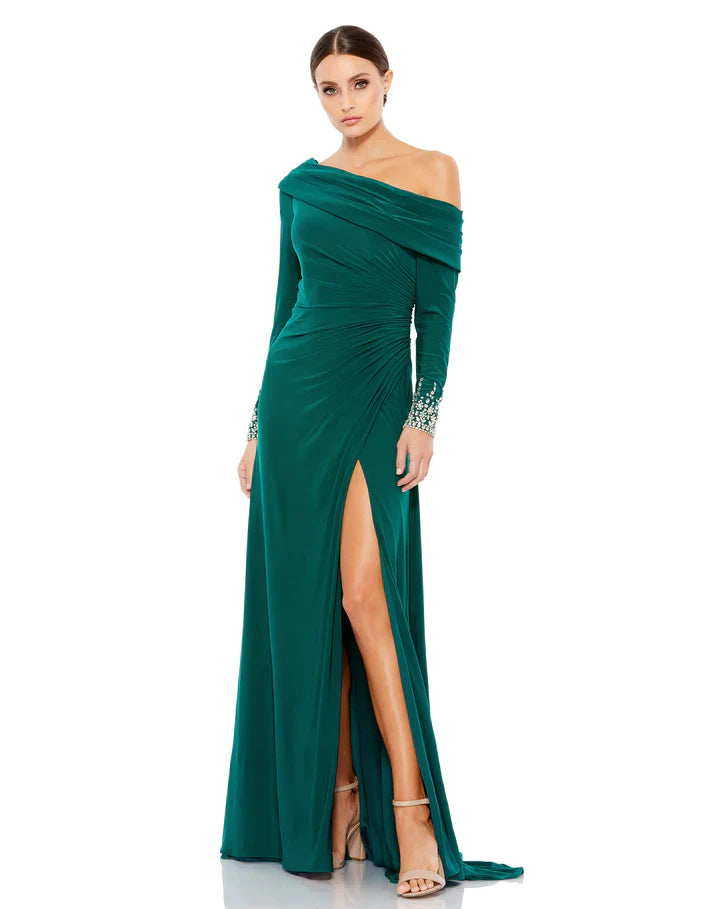 This stunningly elegant, floor-length, emerald green Mac Duggal, evening dress is a long sleeve jersey gown accented with jewelled cuffs and finished with a thigh-high slit! This bodycon, form-fitting evening gown is perfect for proms, black-tie affairs, weddings and special events!