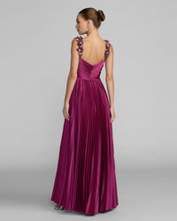 Back view of the magenta satin gown, showing the bodice, zipper, and flowing high-low skirt.
