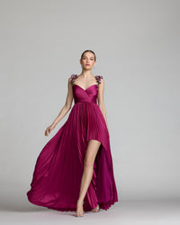 Close-up shot showing the detail of the sweetheart neckline and floral embroidered straps on a magenta gown.