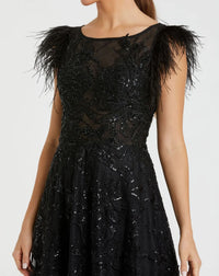 Black dress with feathered shoulders on a white background