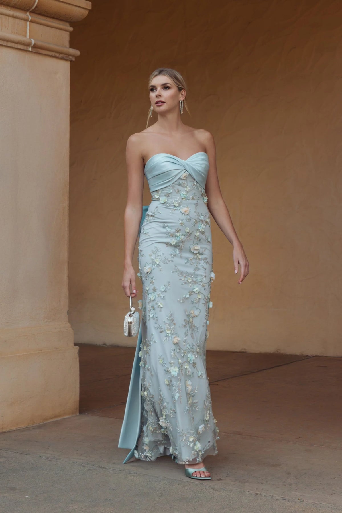 Blue strapless satin mermaid gown with bow details