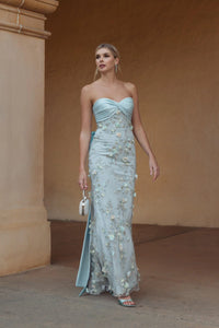 Blue strapless satin mermaid gown with bow details