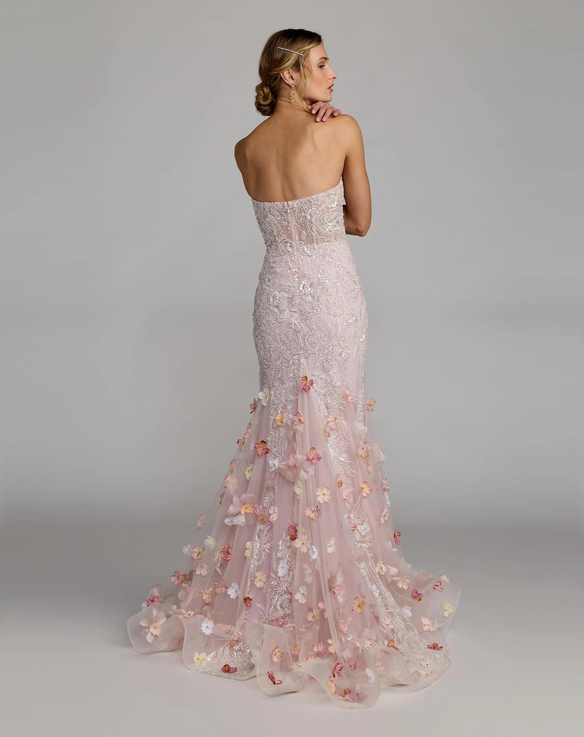 21147-BlushMulti-BK.jpg: Back view of the Blush Multi evening dress highlighting the mermaid flare, embroidered detailing, and concealed zipper.