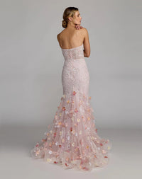 21147-BlushMulti-BK.jpg: Back view of the Blush Multi evening dress highlighting the mermaid flare, embroidered detailing, and concealed zipper.