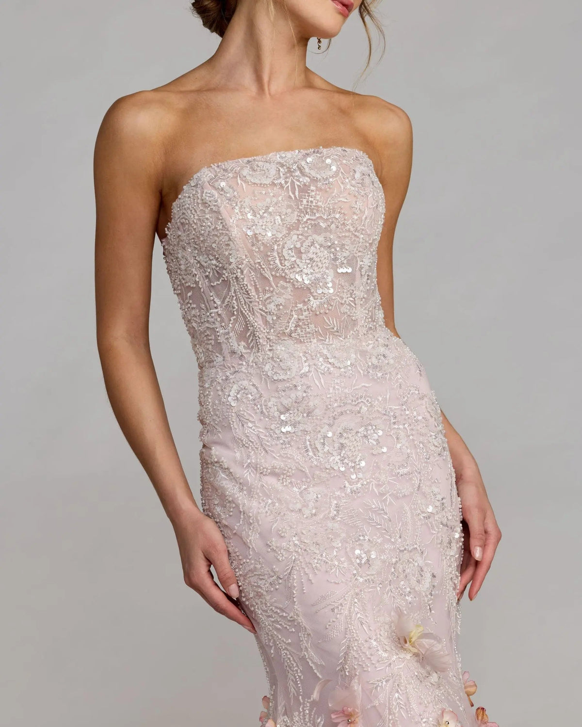 21147-BlushMulti-AB.jpg: Full-length front view of the strapless Blush Multi mermaid gown showcasing the sheer bustier bodice and 3D floral skirt accents.