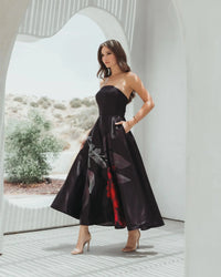 Mac Duggal #21152 Black Printed Satin Strapless Midi Dress Pockets lifestyle shot