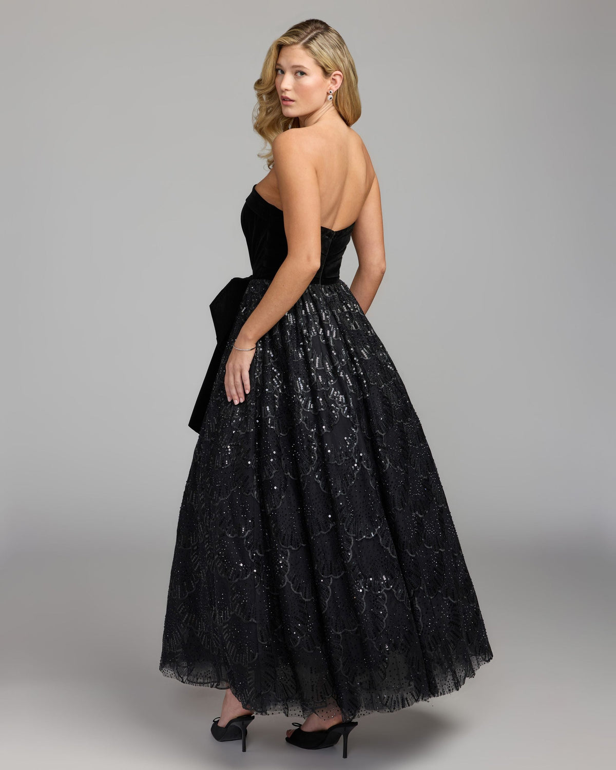 Mac Duggal #21197 black velvet bow sequin strapless a-line gown back view