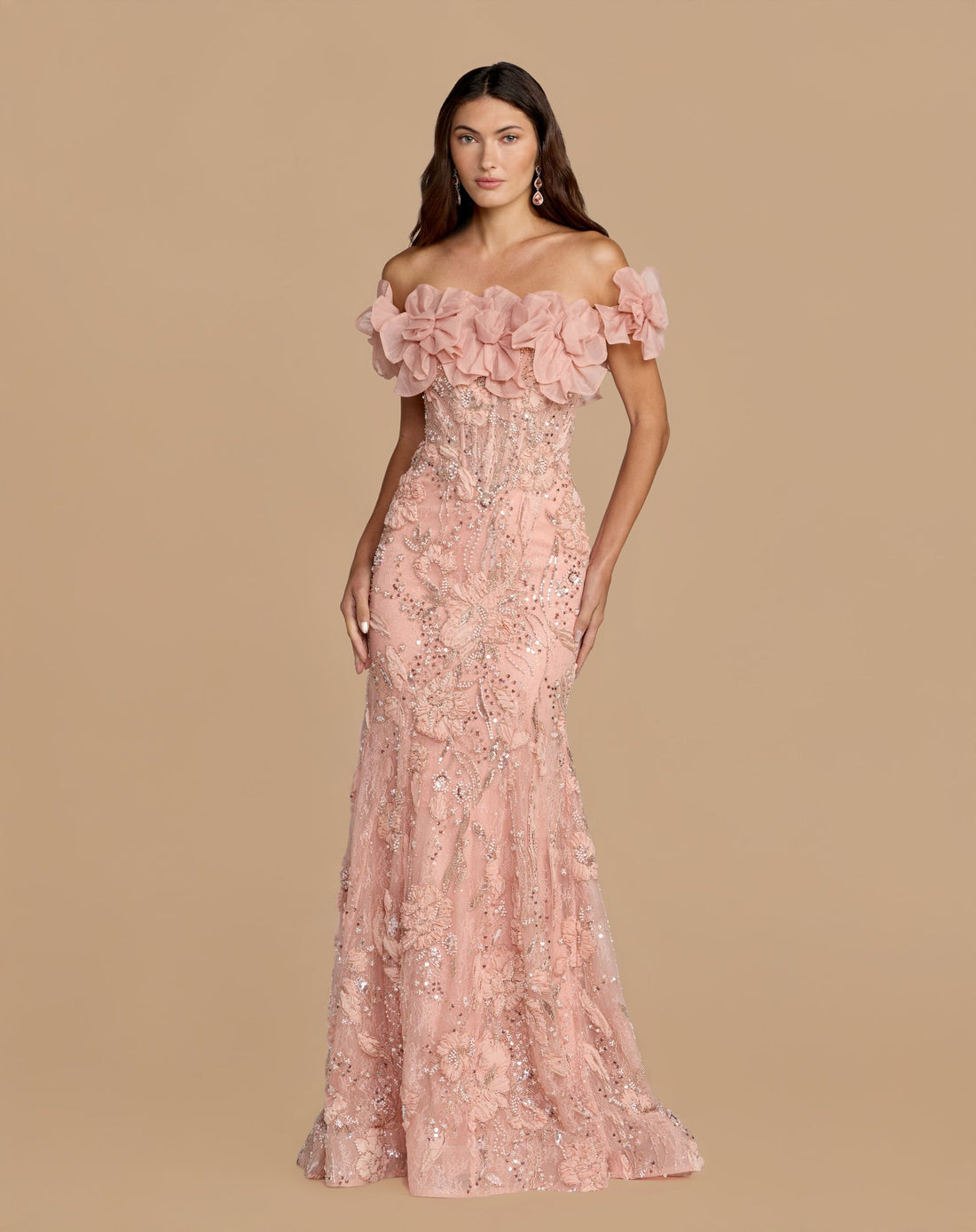 Full-length studio shot of the blush embellished lace mermaid gown with 3D floral rosettes.