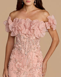 Detailed close-up of the bustier bodice featuring intricate beading, pearls, and sequin work on the blush gown.
