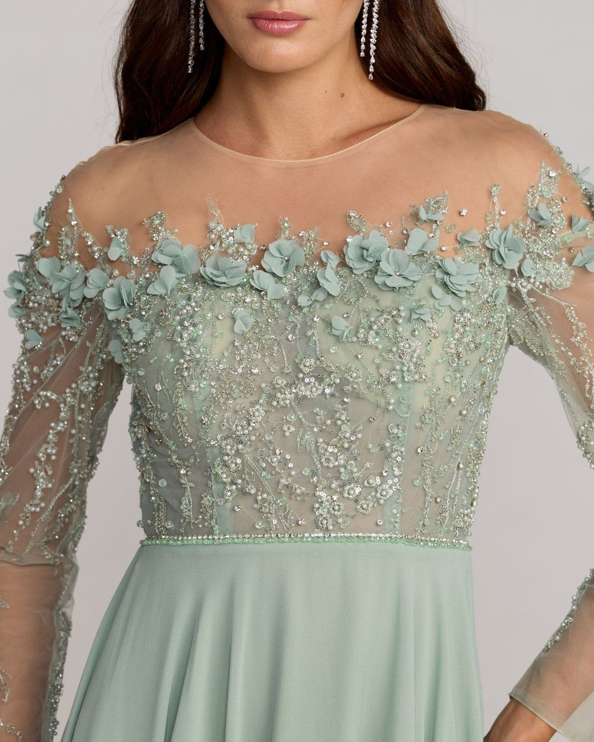 close up of Mac Duggal Style 21315 Sage green tulle gown with floral appliqué and A-line silhouette