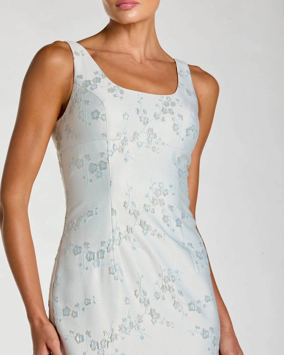 Texture detail of premium blue and multi colored floral jacquard fabric on Mac Duggal dress