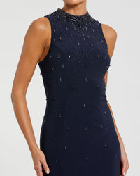 Navy blue dress with bead embellishments on a white background