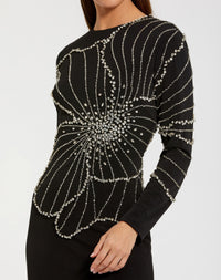 Mac Duggal #2282 black long sleeve jersey gown with beaded flower close-up