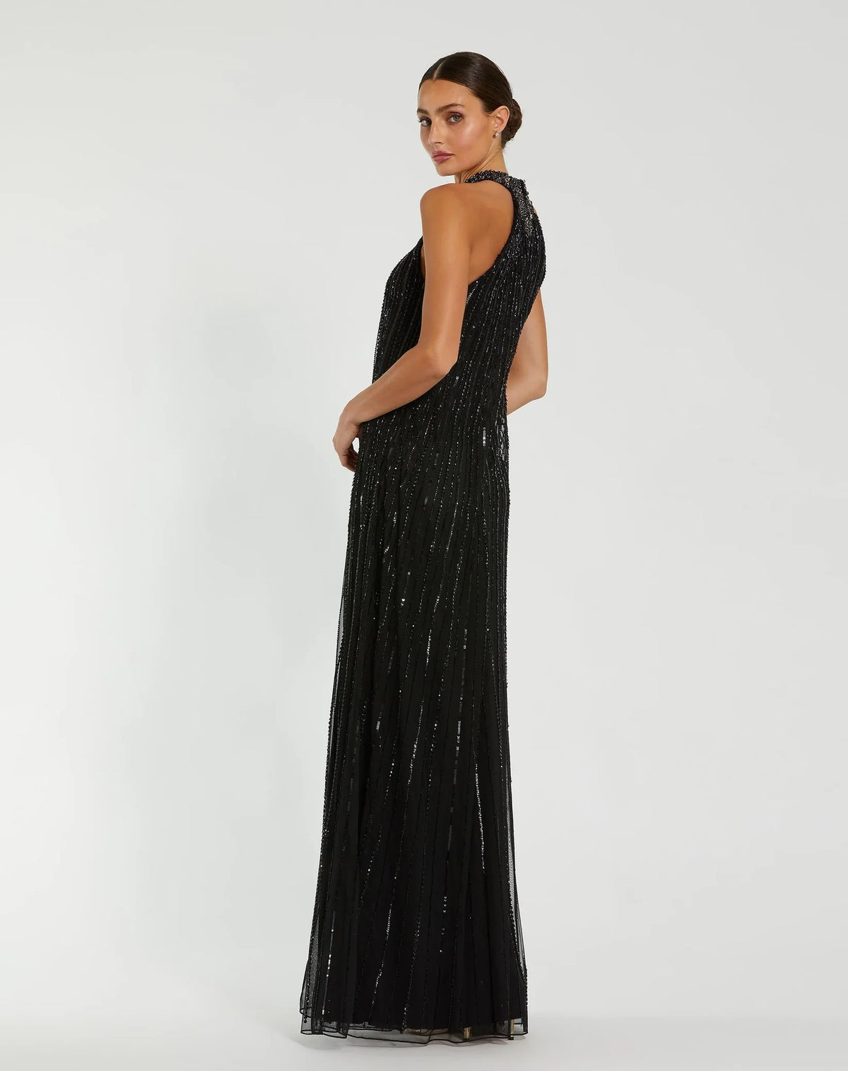 Black sleeveless halter neck embellished trapeze gown
