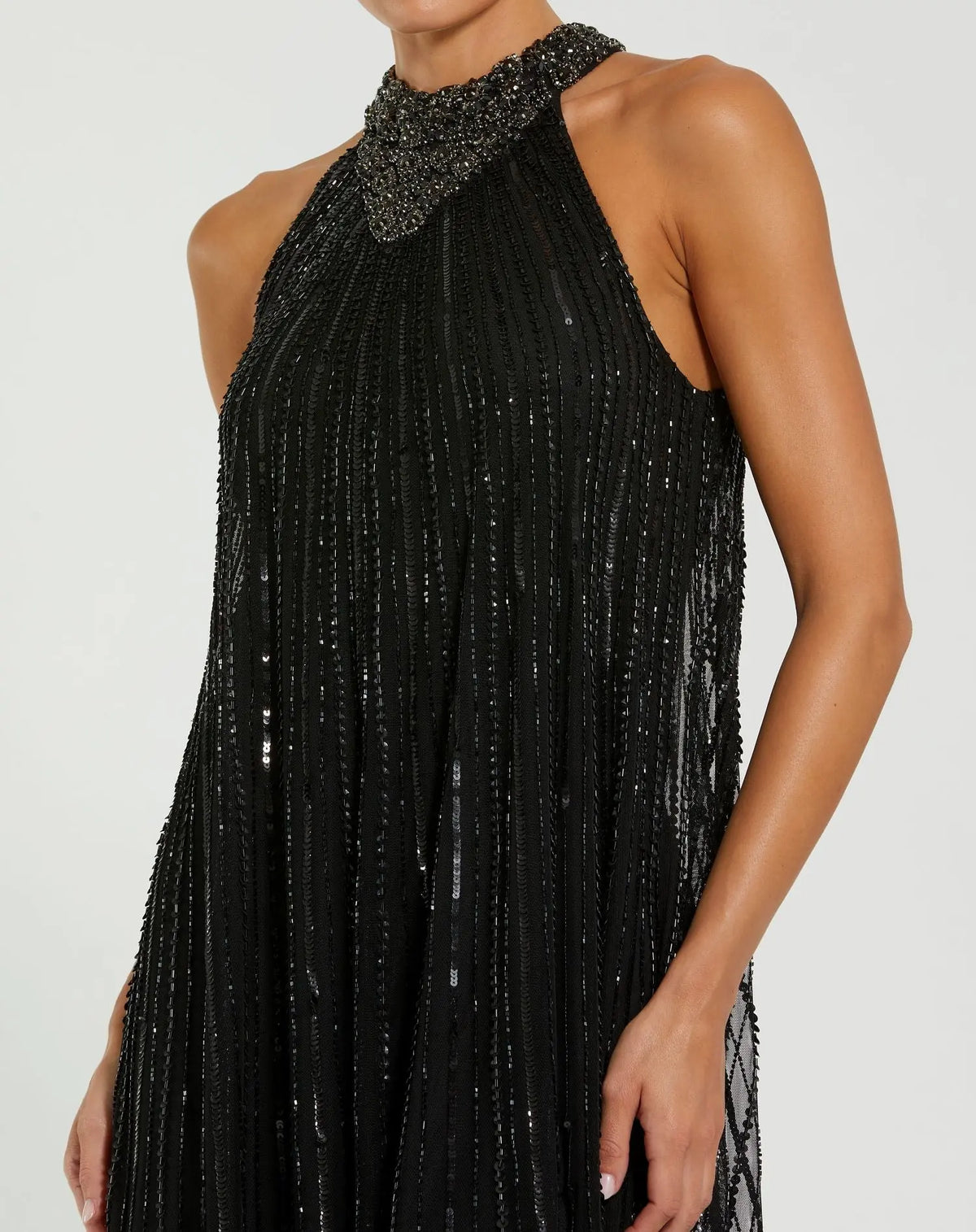 Black sleeveless halter neck embellished trapeze gown