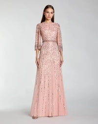 studio shot of model wearing Mac Duggal Green High Neck Embellished Gown With 3/4 Sleeves #23045 Rose Pink 