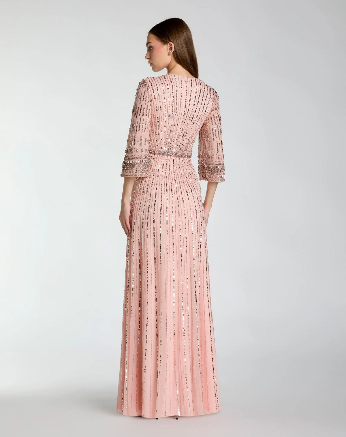 back view of model wearing Mac Duggal Green High Neck Embellished Gown With 3/4 Sleeves #23045 Rose Pink 