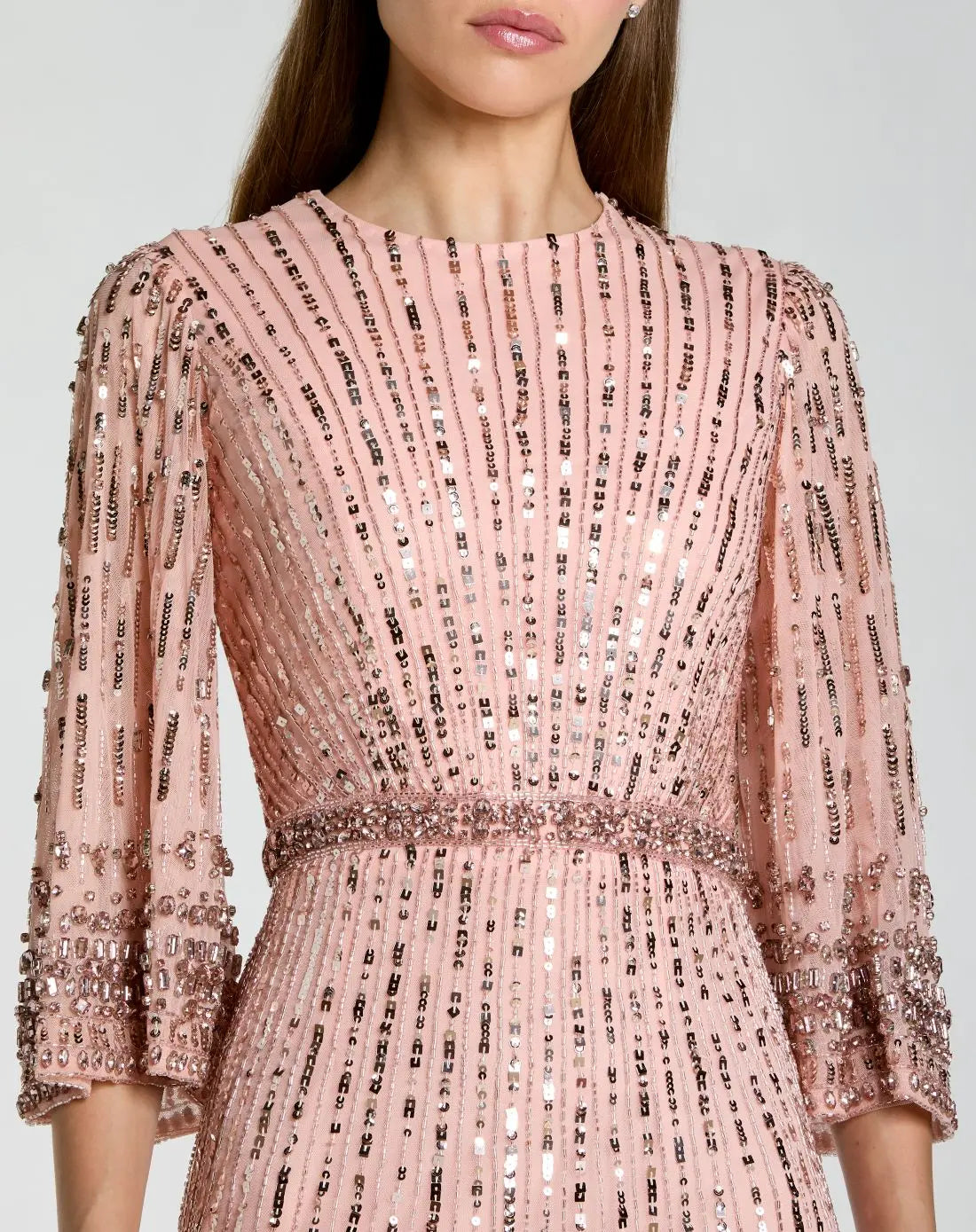 close up studio view of model wearing Mac Duggal Green High Neck Embellished Gown With 3/4 Sleeves #23045 Rose Pink 