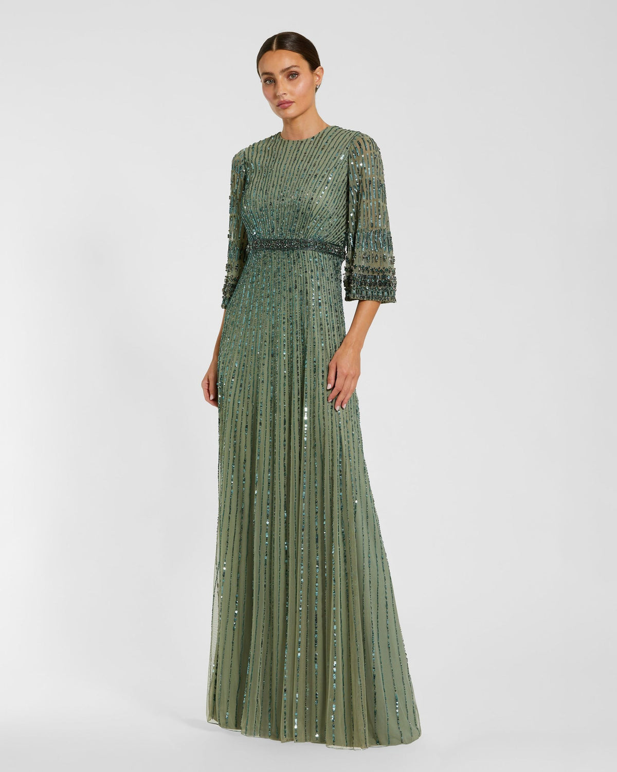 Studio shot of model in Mac Duggal Green High Neck Embellished Gown With 3/4 Sleeves #23045 Seafoam Green 