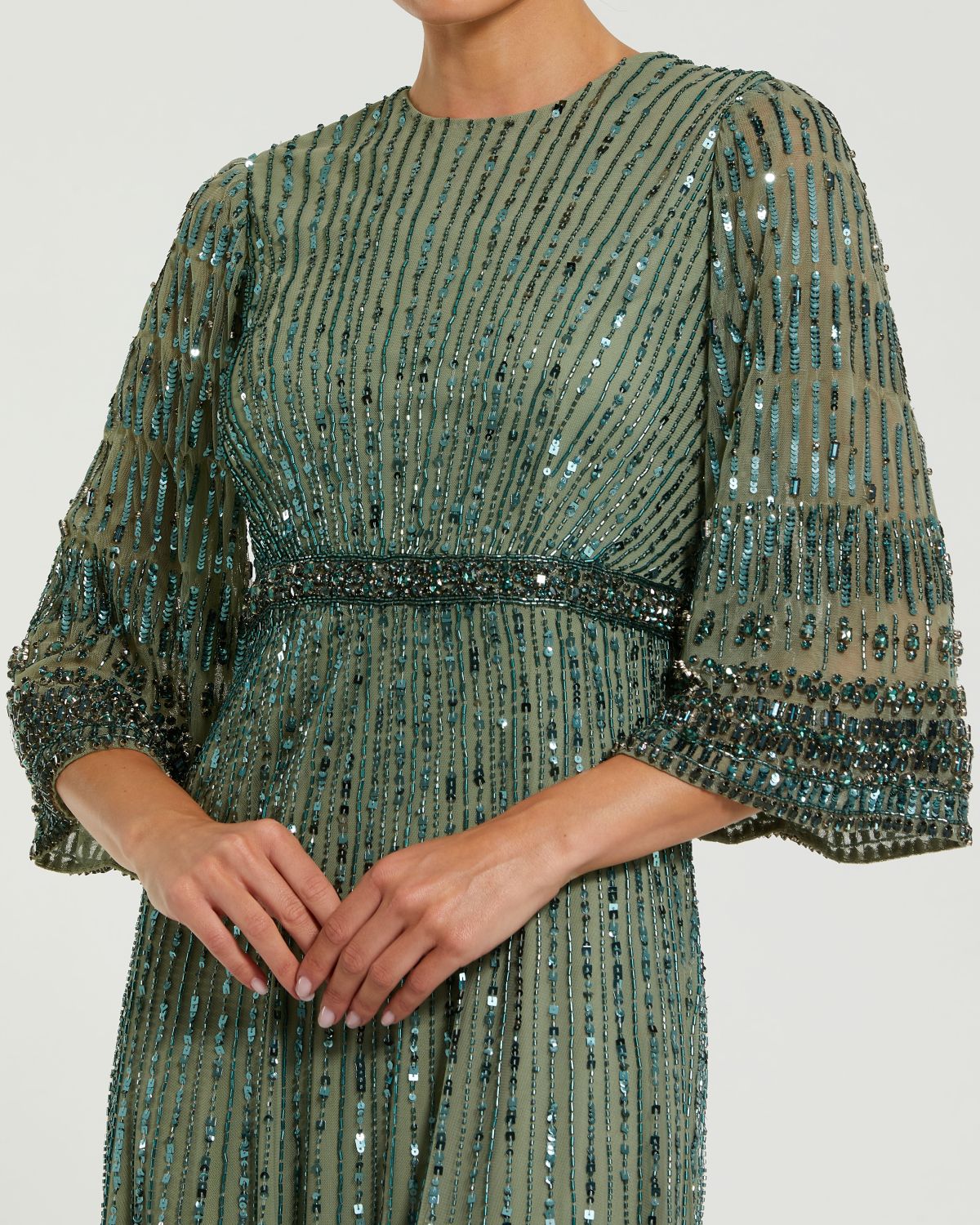 close up studio shot of model wearing the Studio shot of model in Mac Duggal Green High Neck Embellished Gown With 3/4 Sleeves #23045 Seafoam Green 