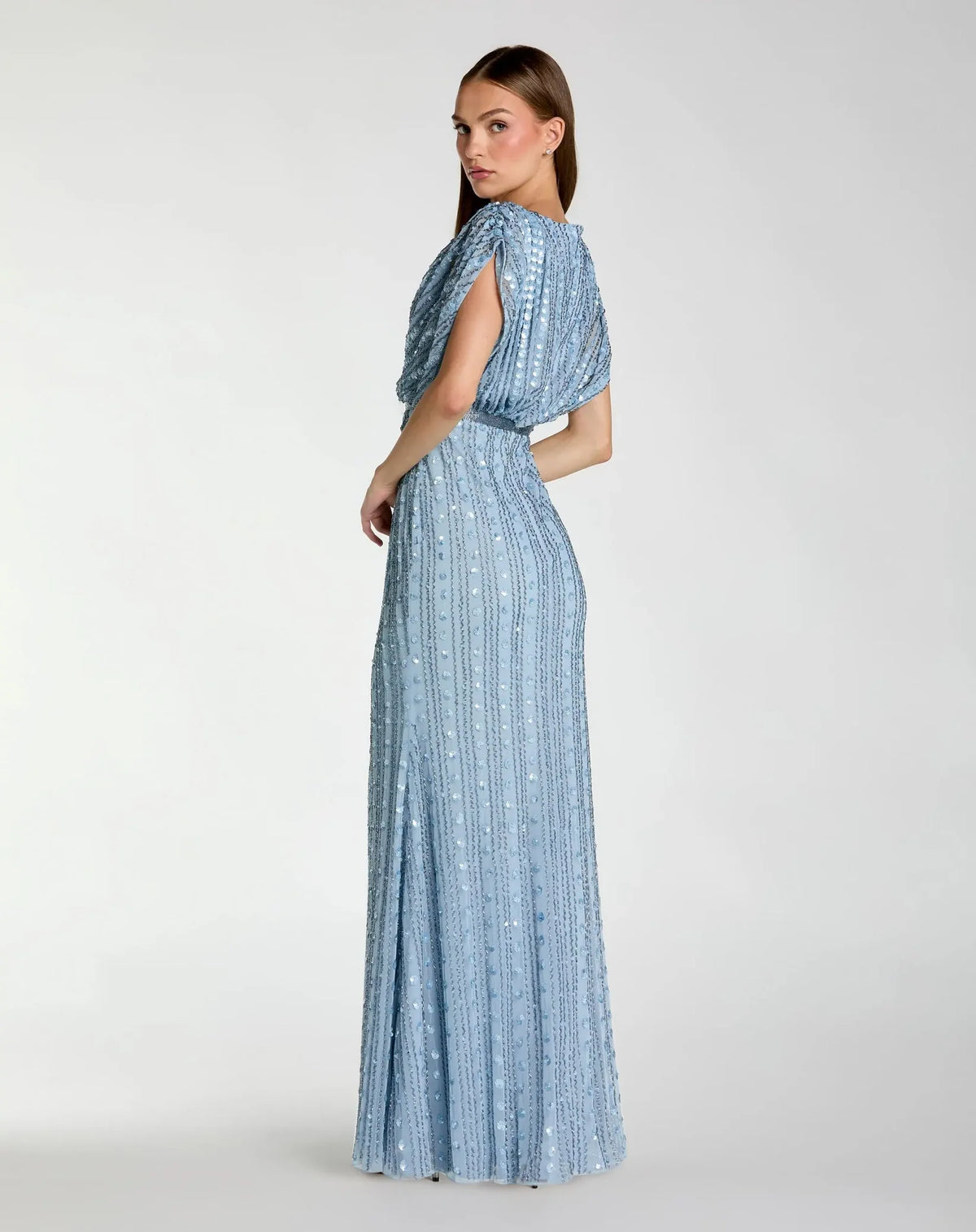 back view of model wearing Mac Duggal Blue Embellished Blouson V Neck Column Gown #23081