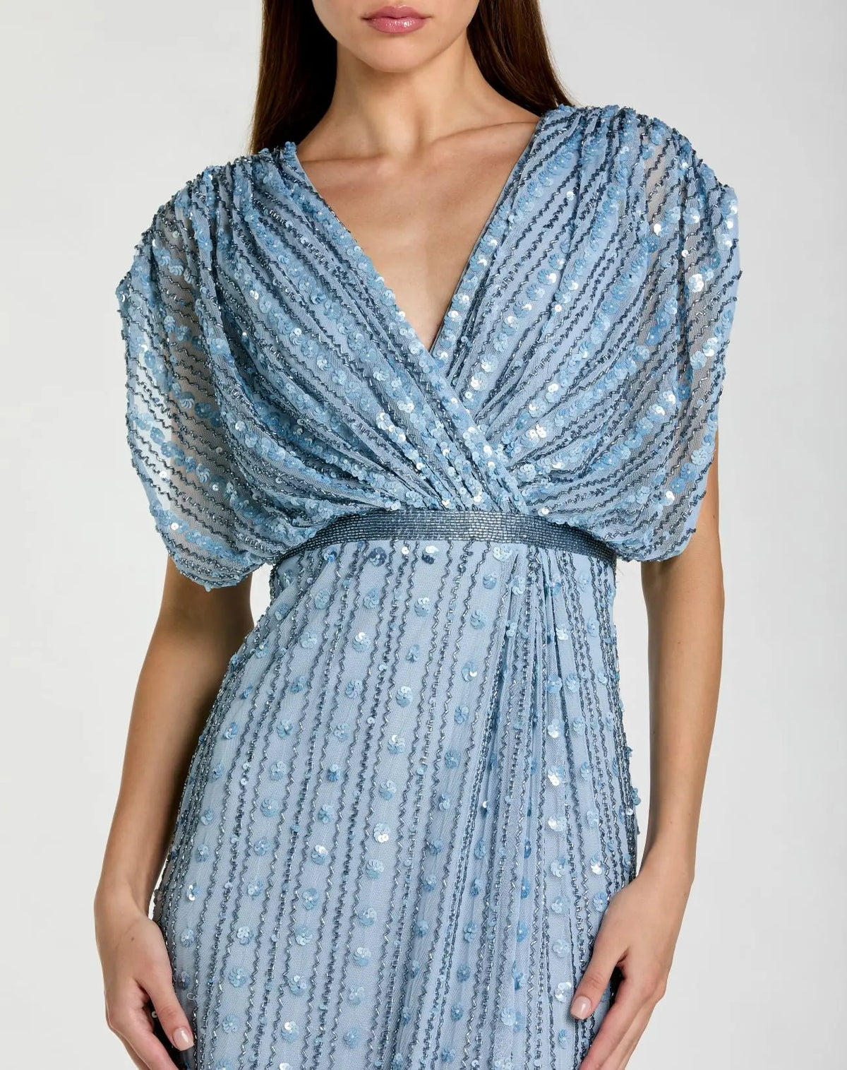 Close up of detail of the Mac Duggal Blue Embellished Blouson V Neck Column Gown #23081