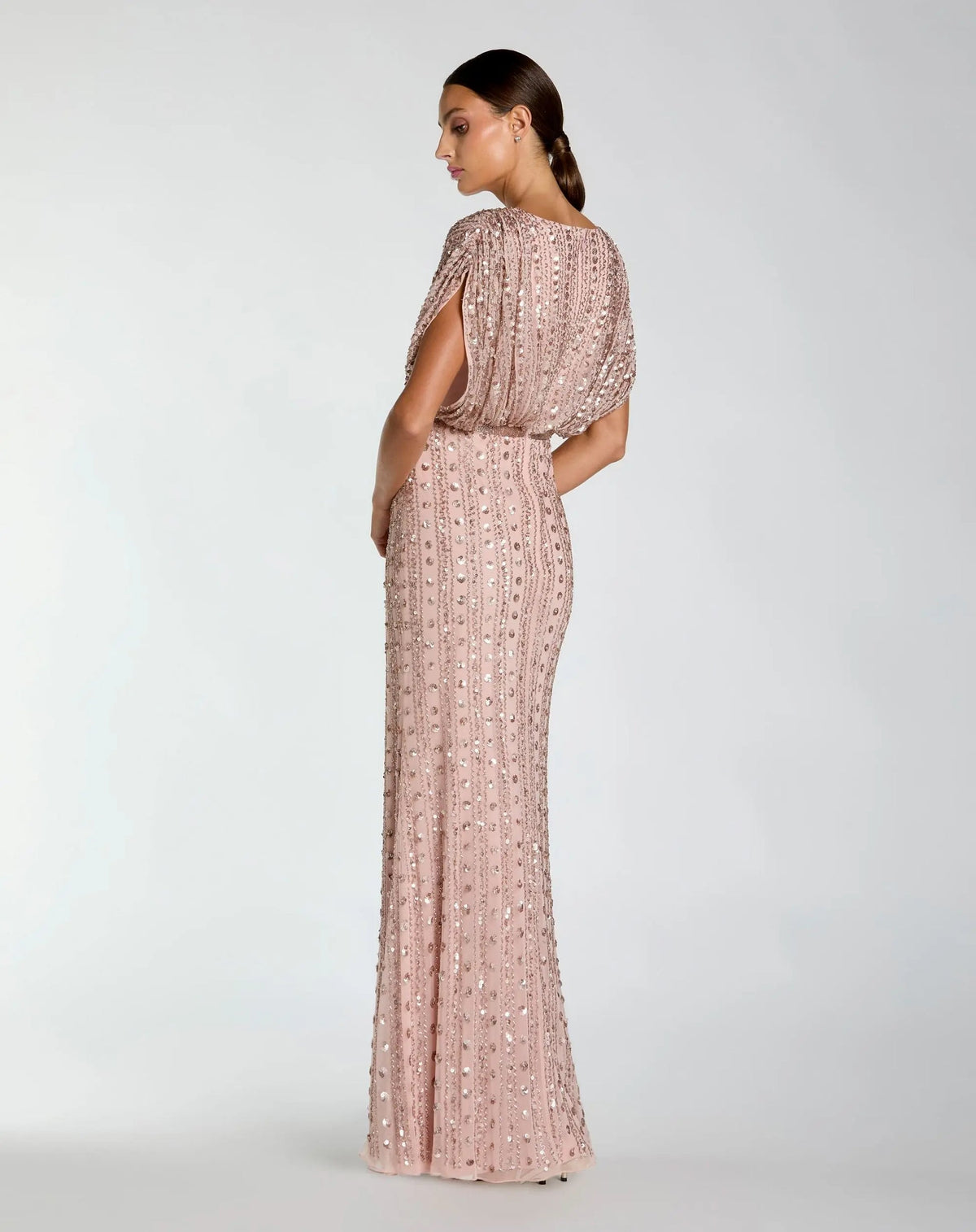 Back view of model wearing Mac Duggal Pink Embellished Blouson V Neck Column Gown #23081