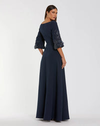 Navy blue evening gown with lace sleeves on a white background