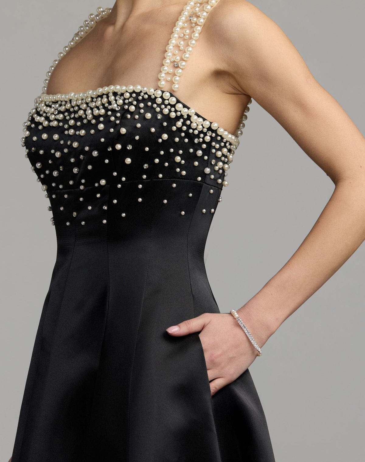 Mac Duggal #2426 black a-line pearl embellished satin gown close-up