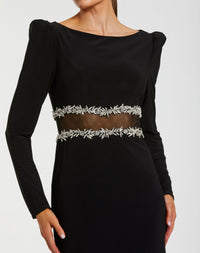 Black dress with silver embellishments on a white background