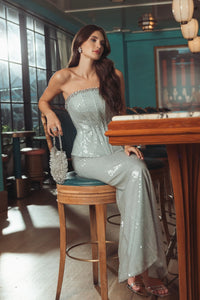 Blue strapless sequin peplum gown with rhinestone trim