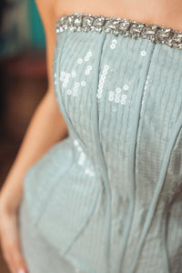 Blue strapless sequin peplum gown with rhinestone trim