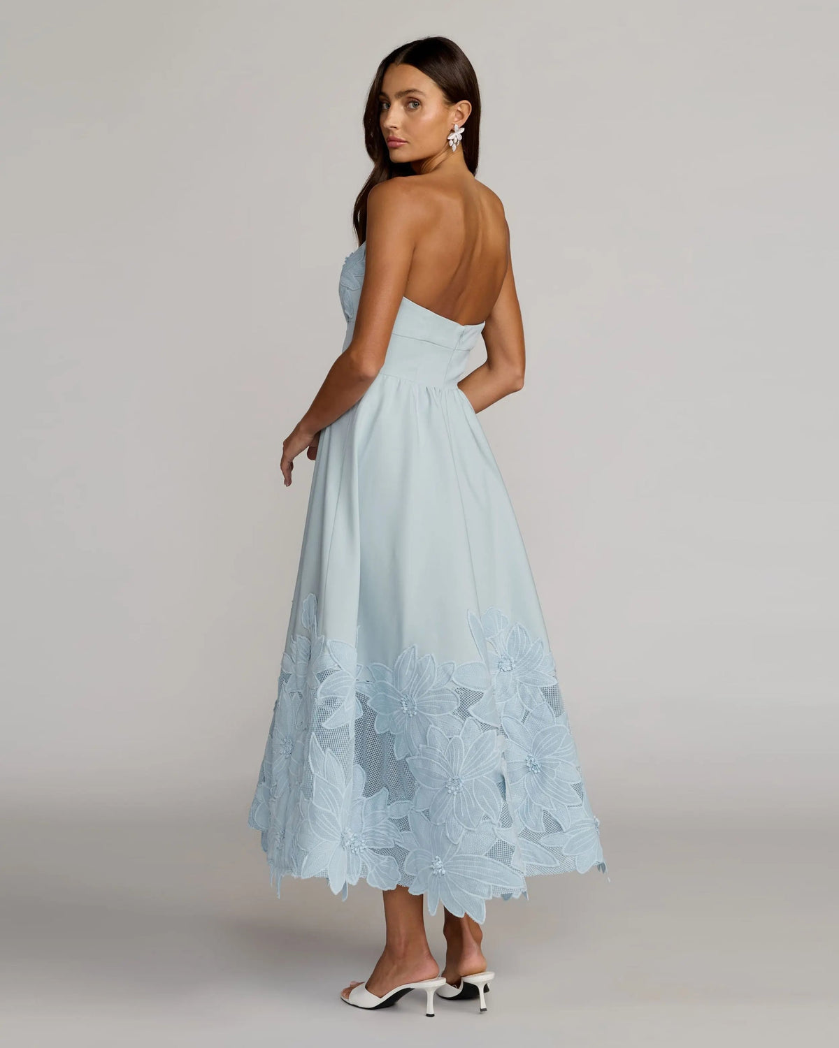 Detailed-view-of-sculptural-floral-appliqué-on-powder-blue-formal-midi