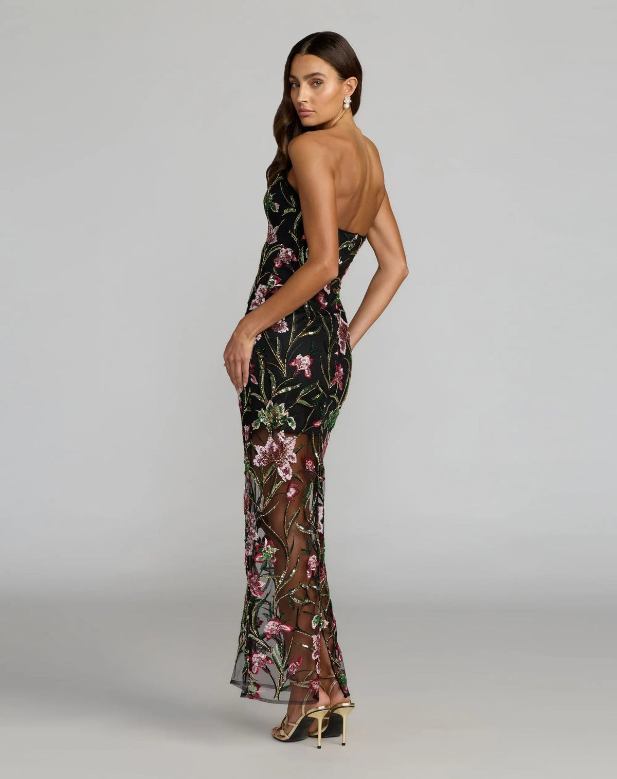 Back-view-of-black-floral-mesh-gown-showing-sheer-lower-skirt