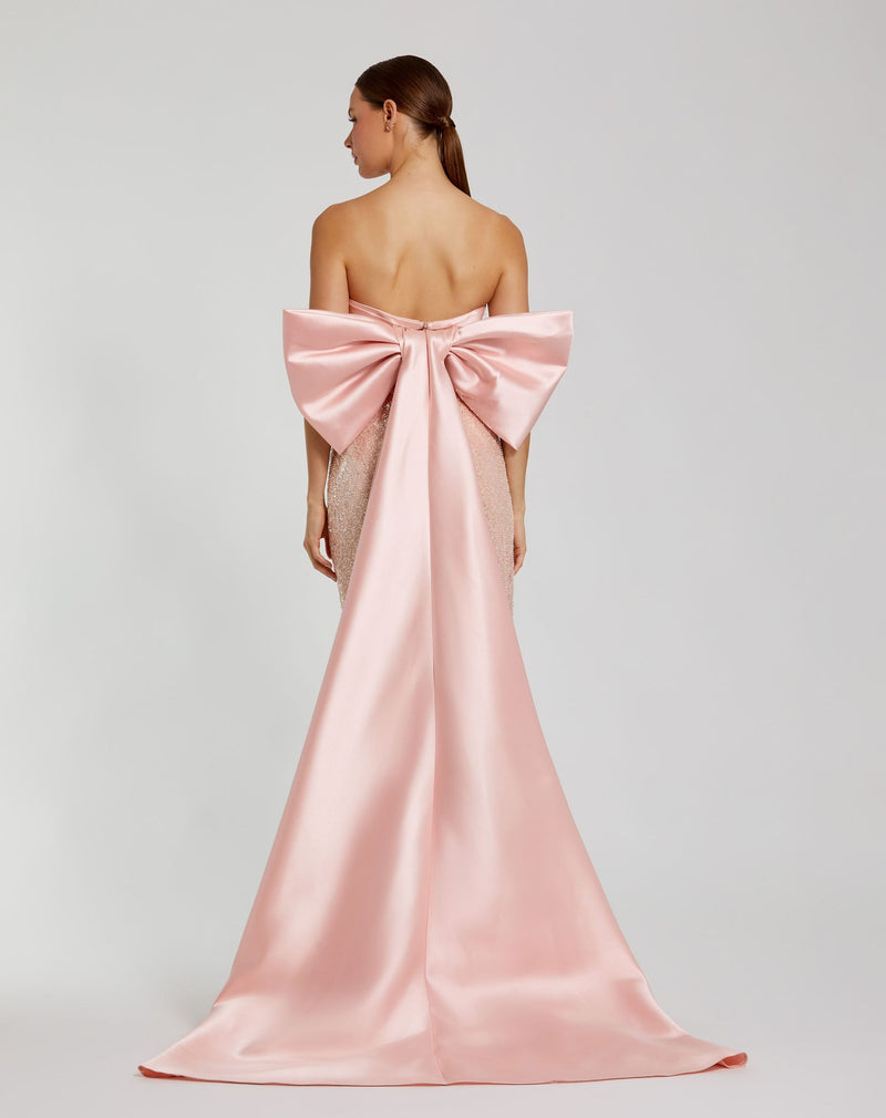 Mac Duggal, Pink Strapless Embellished Gown With Back Bow Detail #37011 Blush Pink | Shop Bridesmaids Dresses, Prom Dresses, Dresses, Wedding Guest Dresses, and Black Tie Evening Gowns Online at SHAIDE! Shaide Boutique Mac Duggal, Pink Strapless Embellished Gown With Back Bow Detail #37011 Blush Pink | Shop Bridesmaids Dresses, Prom Dresses, Dresses, Wedding Guest Dresses, and Black Tie Evening Gowns Online at SHAIDE! Shaide Boutique